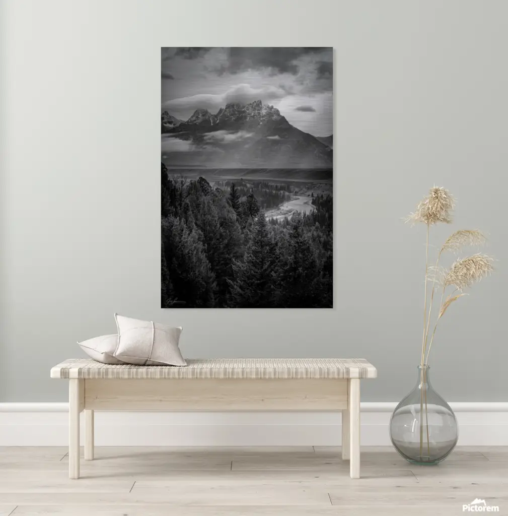 cozy neutral colored bench underneath a large black & white image, showcasing how photography artwork can be incorporated into Interior Design.